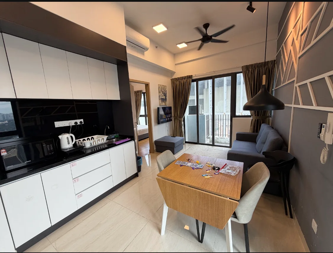 Living features: grey fabric sofa, wooden dining table, 4 dining chairs, black kitchen cabinetry, white lower cabinetry, stainless-steel sink, chrome pull-down faucet, built-in microwave, electric kettle, refrigerator, flat-screen TV, floor-to-ceiling windows, curtains, ceiling fan with light, tile flooring; style: modern; view: city.